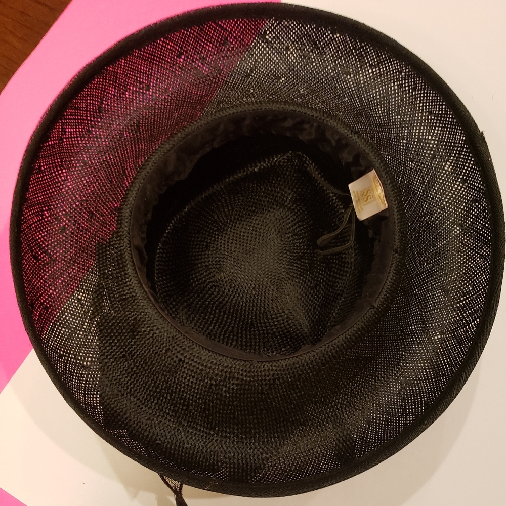 Black  dressing hat in good condition.